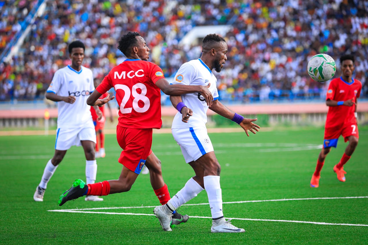 Soccer players competing fiercely during a match in Mogadishu, Somalia.